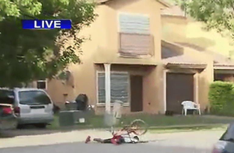 Boy Face Plants While Riding Bike in Background of Live Newscast