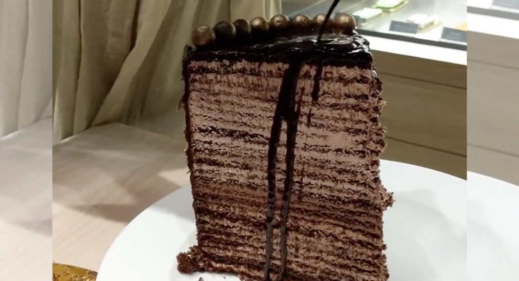 Watch These People Struggle To Eat A 48-Layer Cake