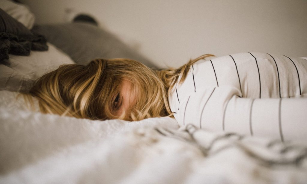 woman lying on bed