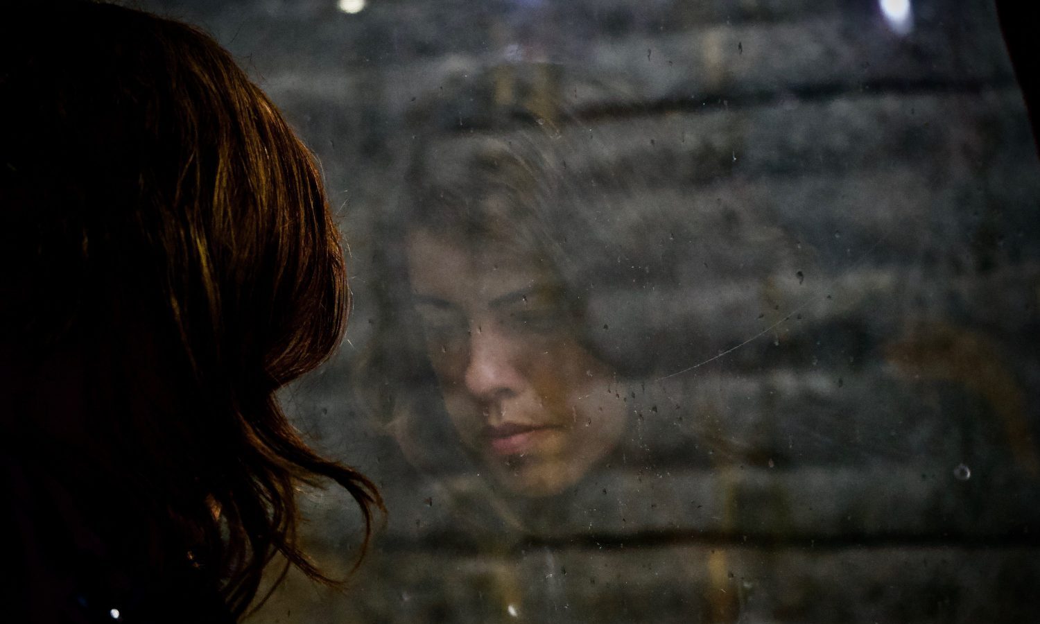 woman looking at the floor