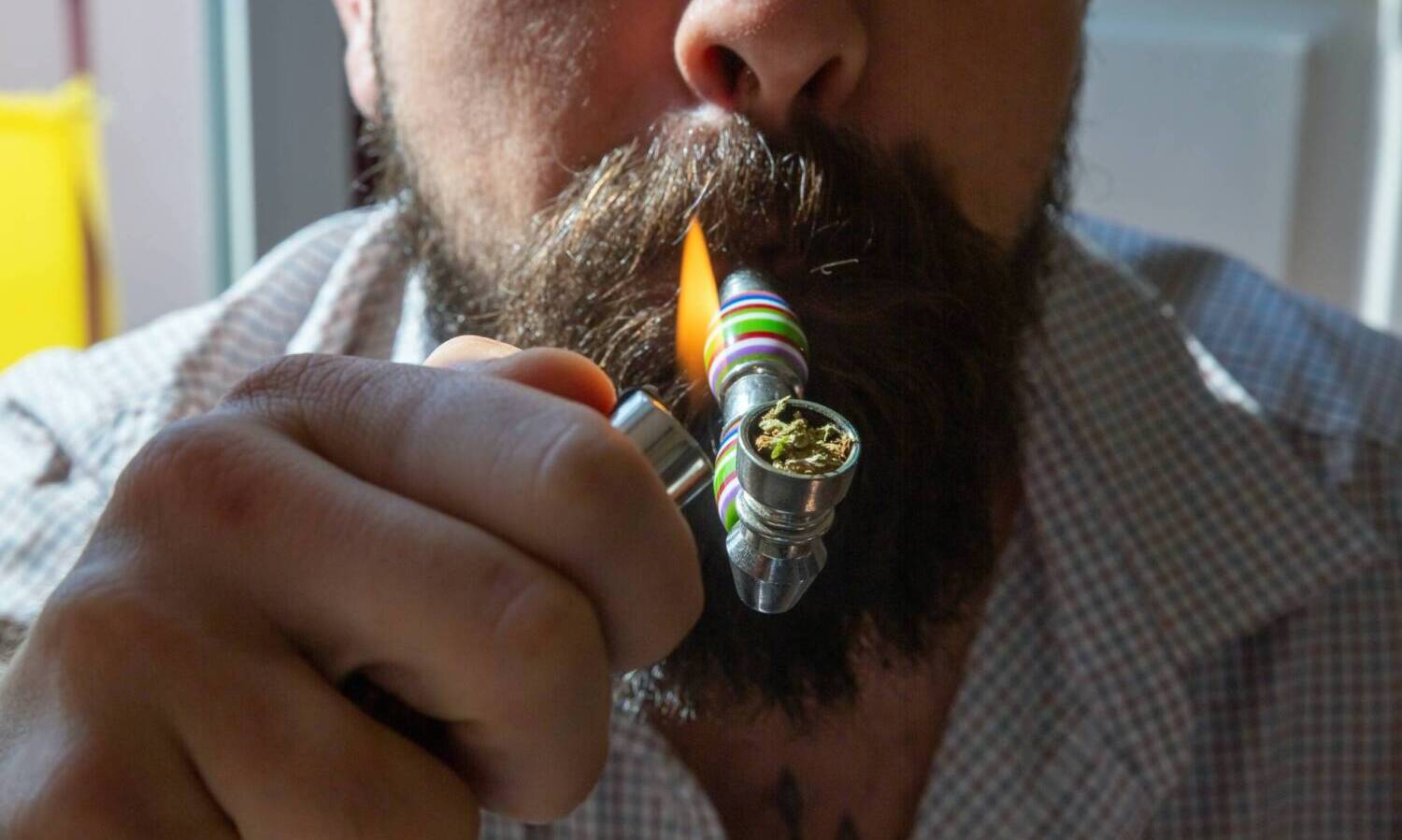 Smoking a marijuana pipe