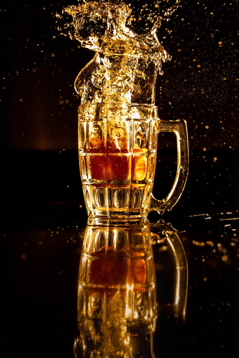 clear glass mug with brown liquid