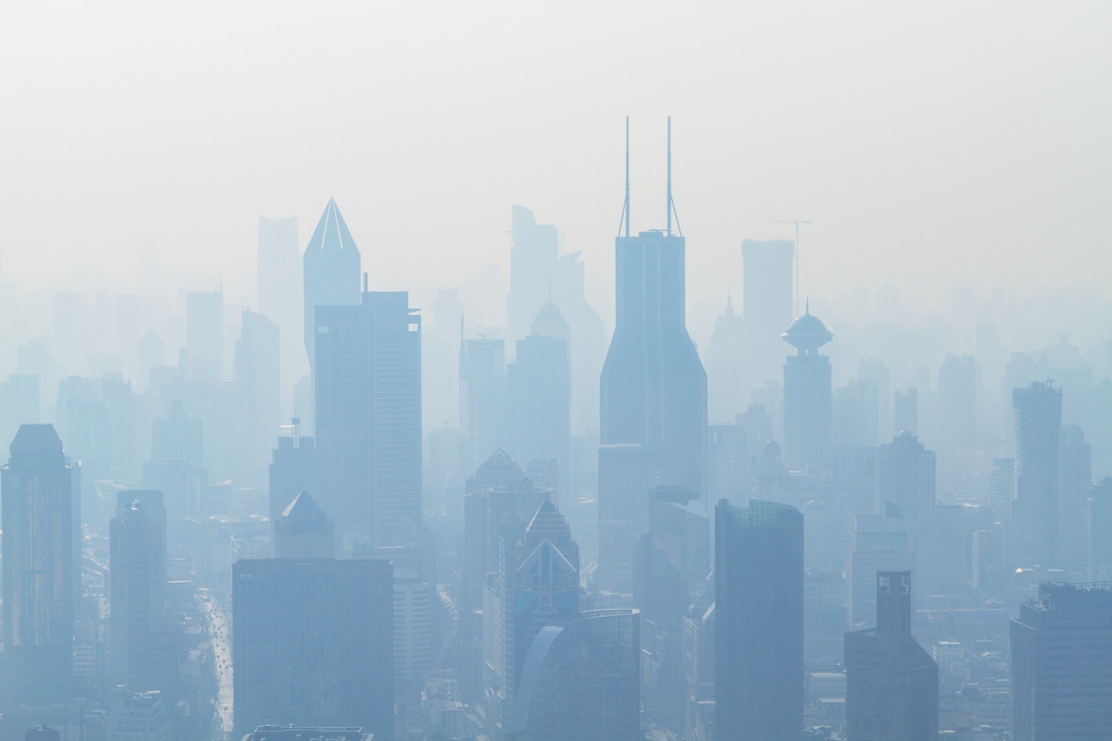 aerial view of high-rise buildings covered with smoke