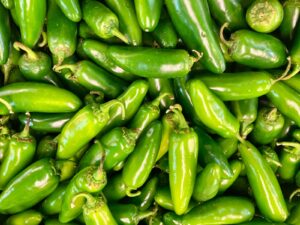 green chili peppers in close up photography